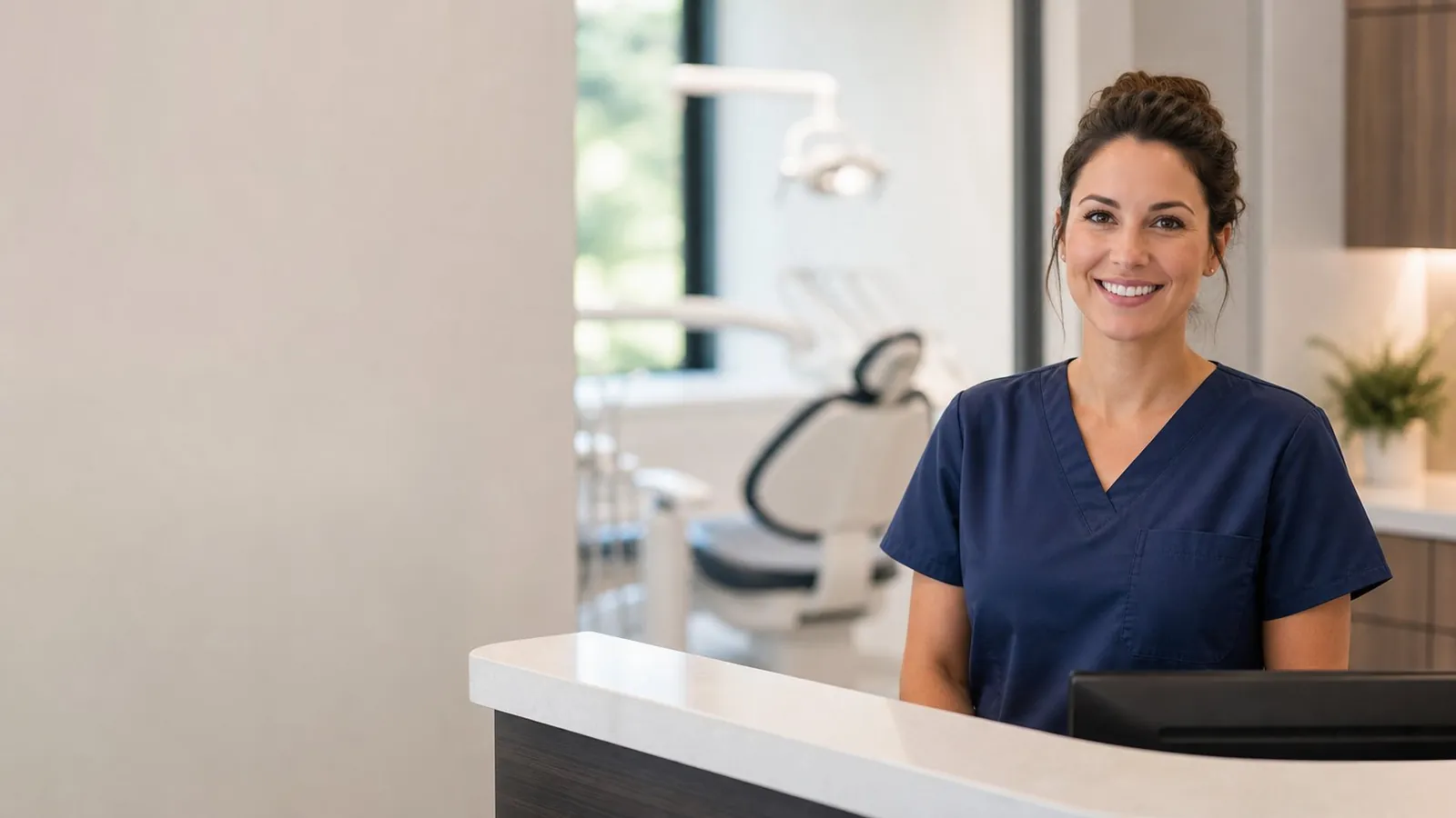 Dentist at a modern practice reception desk